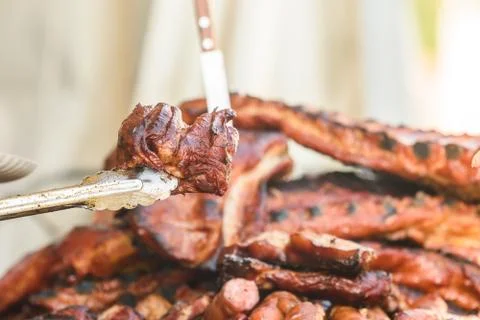 Preparing Steaks On Barbecue Day Stock Photos