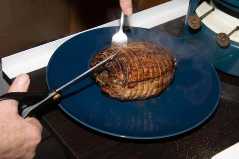 Preparing a stew with pork roll Foto stock