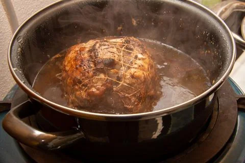 Preparing a stew with pork roll Stock Photos