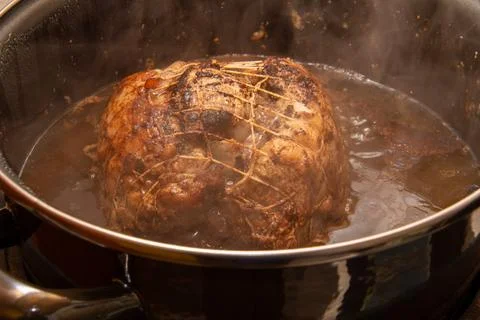 Preparing a stew with pork roll Stock Photos