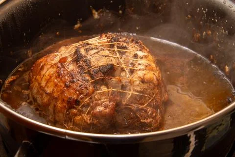 Preparing a stew with pork roll Stock Photos