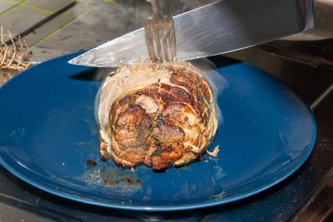 Preparing a stew with pork roll Stock Photos
