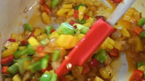 Preparing a stew of roasted ribs, adding peppers Stock Footage 219720563