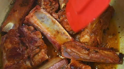 Preparing a stew of roasted ribs, finishing frying them Stock Footage 219720335