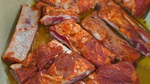 Preparing a stew of roasted ribs, frying them with oil Stock Footage 219720252
