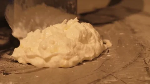Preparing Stir-Fried Rolled Ice Cream on a Cold Plate Stock Footage 345293161