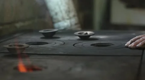 Preparing the stove (smoking) _2 Stock Footage 12240322