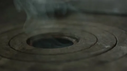 Preparing the stove (smoking) Stock Footage 12239945