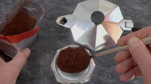 Preparing a stovetop coffee maker for brewing. Video stock 88657106