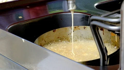 Preparing Strauben 1/3. Typical austrian sweet in hot oil Stock Footage 79349939