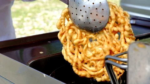 Preparing Strauben 2/3. Typical austrian sweet in hot oil Stock Footage 79339847