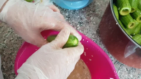 Preparing stuffed Zucchini (with rice and meat) at kitchen. Video stock 98761766