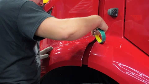 Preparing the surface with a tape for applying a PPF film to a car. Close up 스톡 동영상 294962716