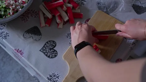 Preparing Surimi Sticks by Cutting Them Into Small Pieces Stock Footage 341767566