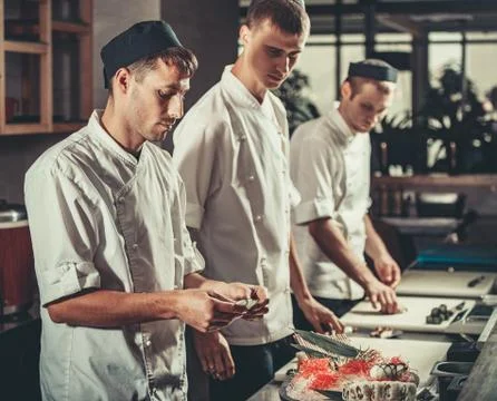 Preparing sushi set in restaurant kitchen Stock Photos