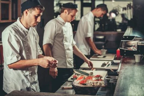 Preparing sushi set in restaurant kitchen Fotos Stock
