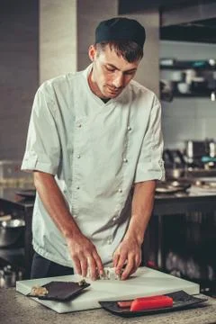 Preparing sushi set in restaurant kitchen Fotos Stock