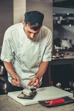 Preparing sushi set in restaurant kitchen Stock Photos