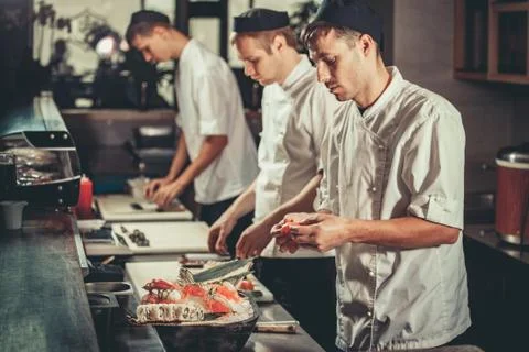 Preparing sushi set in restaurant kitchen Stock Photos