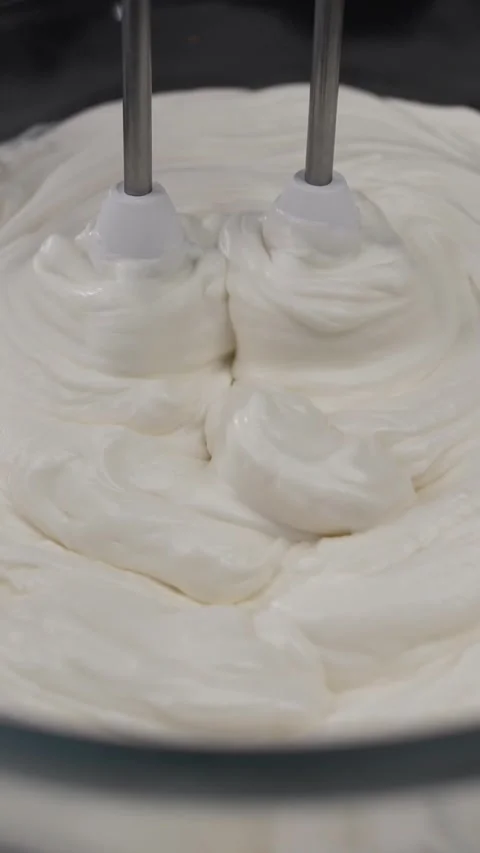 Preparing a sweet, thick, creamy egg white whites custard for chicken egg fudge. Stock Footage 281668376