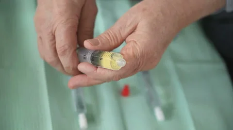 Preparing syringe of antibiotic Stock Footage 1094607