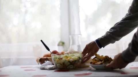 Preparing the table to eat at the table. Stock Footage 116560366