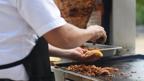 Preparing TACOS AL PASTOR close up shot Stock Footage 128096287