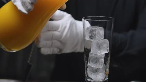 Preparing a Tequila Sunrise Cocktail Stock Footage 131362836