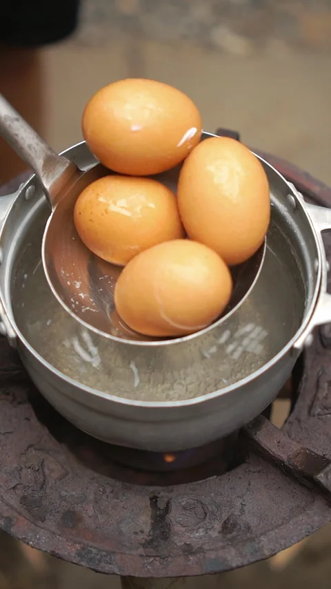 Preparing Thai boiled eggs seasoned with savory soy sauce. Stock Footage 336726692