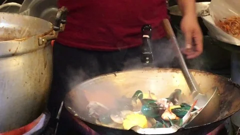 Preparing Thai Seafood Meal in Large Wok 스톡 동영상 76941536