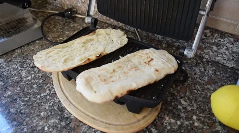 Preparing of a toasted bread roll Stock Footage 64626939