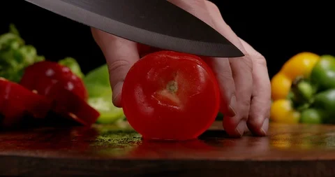 Preparing tomato on kitchen to cook healthy lunch Stock Footage 125852034