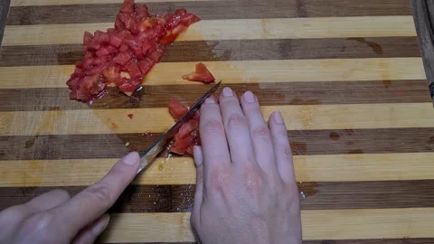 Preparing Tomato Sauce At Home. Cut Tomatoes In Small Pieces  Stock Footage 157396830