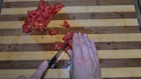 Preparing Tomato Sauce At Home. Cut Tomatoes In Small Pieces  Stock-Footage 157396839