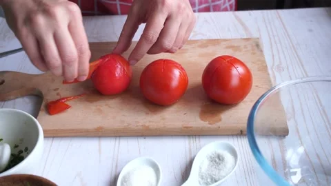 Preparing tomato sauce at home. take off tomatoes skin  Stock Footage 153104795