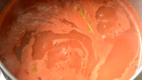 Preparing tomato soup in steinless steel pot. Stock Footage 75343608