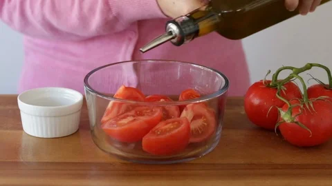 Preparing Tomatoes with Olive OIl Stock Footage 88169328