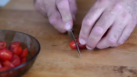 Preparing tomatoes for pizza or salad. Close-up slicing and mixing of chopp.. Video stock 279545272