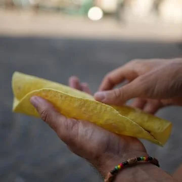 Preparing a tortilla wrap with hands Stock Photos
