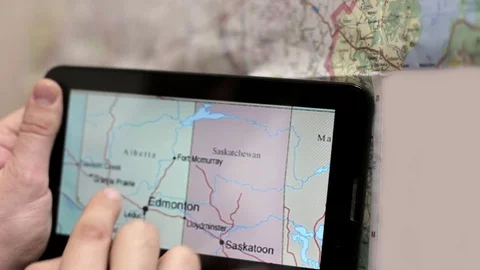 Preparing for the Tourist Trip Using a the Tablet and Map Video stock 71871307