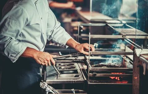 Preparing traditional beef steak Fotos Stock