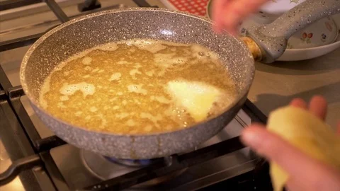 Preparing traditional dessert fried in the pan Stock Footage 85214931