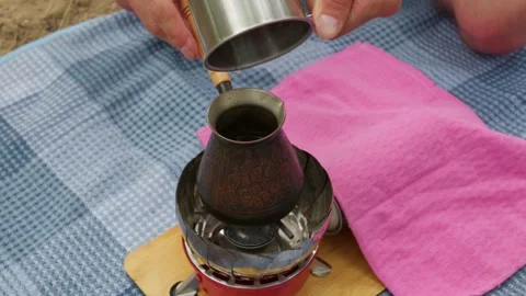 Preparing Traditional Turkish Coffee on a Small Portable Gas Stove Stock Footage 341995041