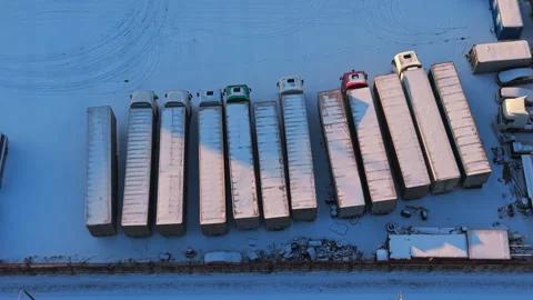 Preparing trailers for shipment, Sunshine illuminates trailers positioned for Stock Footage 325411378