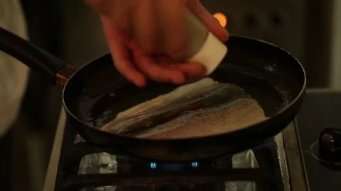 Preparing trout in a cooking pan Stock Footage 132054701
