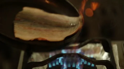 Preparing trout in a cooking pan Stock Footage 132054754