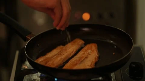 Preparing trout in a cooking pan Stock Footage 132054806