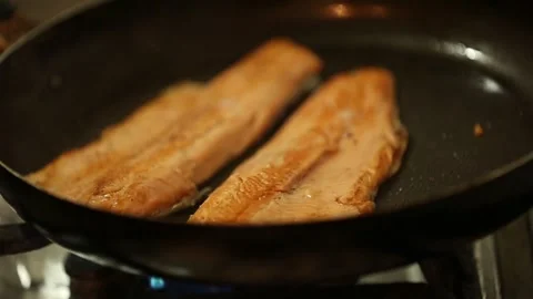 Preparing trout in a cooking pan Stock Footage 132054901