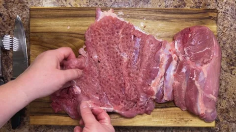 Preparing the turkey thigh for the roulade.  動画素材 328294456