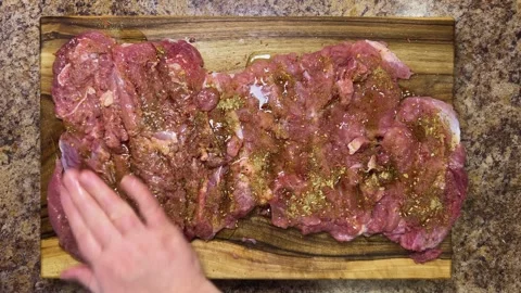 Preparing the turkey thigh for the roulade.  Video stock 328295435